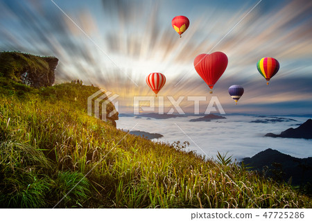 Colourful hotair balloons flying over the mountain 47725286