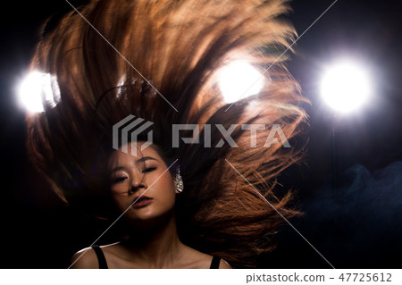 Fashion Asian Woman dark smoke back rim light 47725612