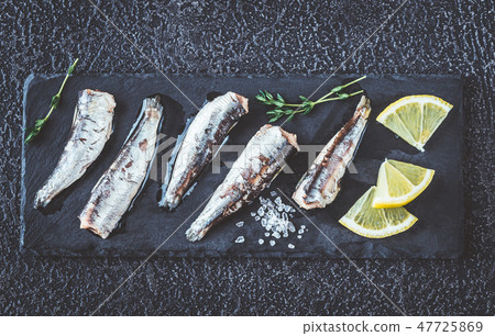 Sardines on the black stone board Sardines on the black stone board 47725869