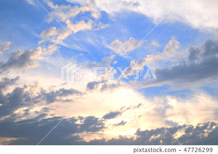 Layered clouds shining brightly in backlight 47726299