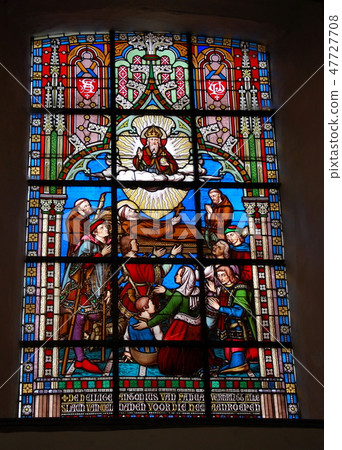 Stained glass in a Catholic church  47727708
