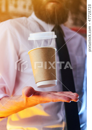 Barista and levitating cup of hot coffee Barista and levitating cup of hot coffee 47728728