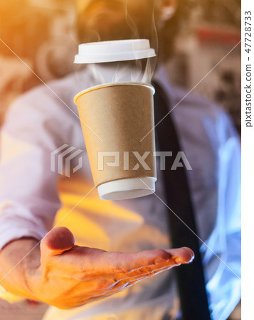 Barista and levitating cup of hot coffee Barista and levitating cup of hot coffee 47728733