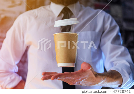 A waiter and a hovering cup of hot coffee A waiter and a hovering cup of hot coffee 47728741