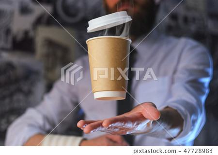 A waiter and a hovering cup of hot coffee A waiter and a hovering cup of hot coffee 47728983