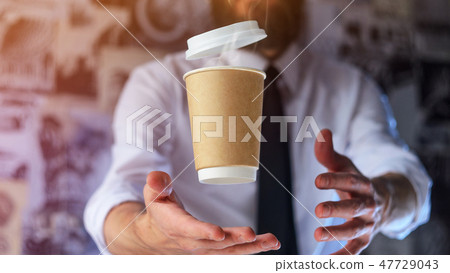 Barista and levitating paper cup of hot coffee Barista and levitating paper cup of hot coffee 47729043