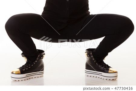 Teen fashion. Female legs in sneakers Teen fashion. Female legs in sneakers 47730416
