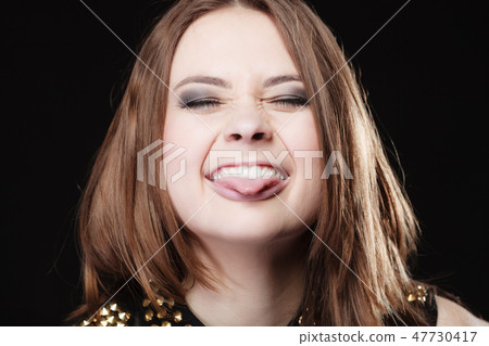 people concept - teenage girl making silly face people concept - teenage girl making silly face 47730417