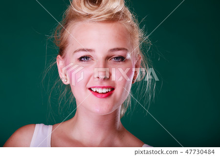 Beautiful smiling young woman with pin up hair 47730484