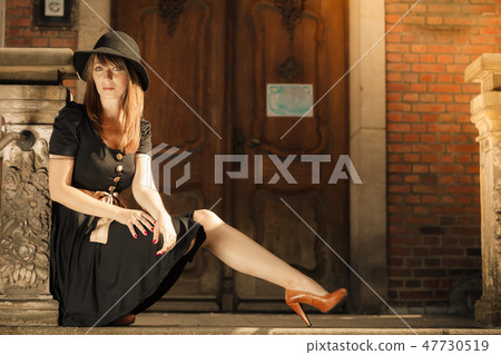 Retro style fashion woman in old town Retro style fashion woman in old town 47730519