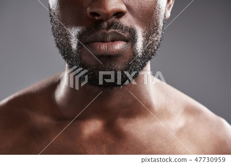Close of an afro American male chin Close of an afro American male chin 47730959