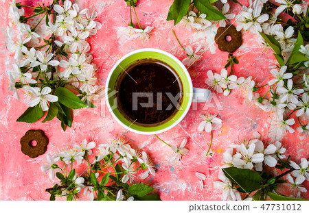 Cup of coffee and cherry blossom flowers Cup of coffee and cherry blossom flowers 47731012