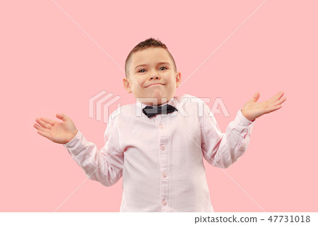 Beautiful teen boy looking suprised and bewildered isolated on pink Beautiful teen boy looking suprised and bewildered isolated on pink 47731018