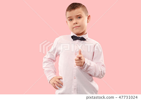 The teen boy point you. portrait on pink background. The teen boy point you. portrait on pink background. 47731024