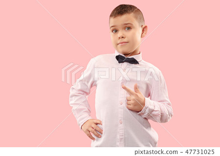 The teen boy point you. portrait on pink background. The teen boy point you. portrait on pink background. 47731025