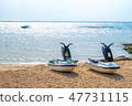 2 Jetskis resting on the beach 47731115
