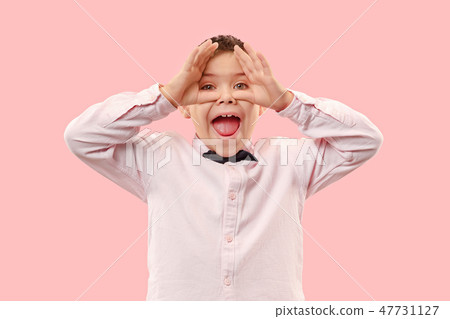 Winning success boy happy ecstatic celebrating being a winner. Dynamic energetic image of male model Winning success boy happy ecstatic celebrating being a winner. Dynamic energetic image of male model 47731127