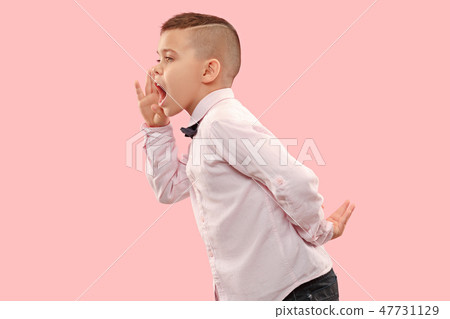 Isolated on pink young casual boy shouting at studio Isolated on pink young casual boy shouting at studio 47731129