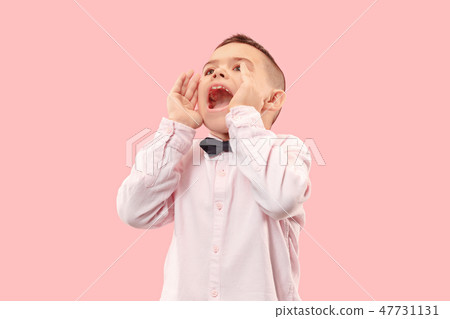 Isolated on pink young casual boy shouting at studio Isolated on pink young casual boy shouting at studio 47731131