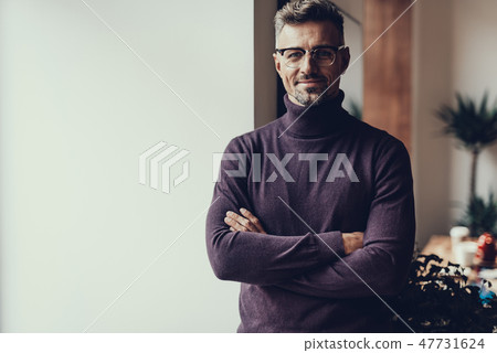 Mature man looking at camera and smiling Mature man looking at camera and smiling 47731624