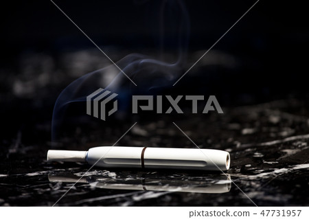 white electronic smoke device dark marble backgrou white electronic smoke device dark marble backgrou 47731957