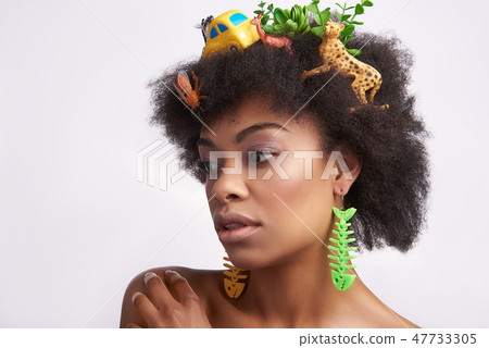 Sensual young ethnic lady with animals hairstyle Sensual young ethnic lady with animals hairstyle 47733305