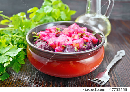 Salad of beets and potatoes with oil in bowl Salad of beets and potatoes with oil in bowl 47733366