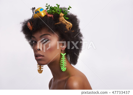 Graceful ethnic model with odd safari hairstyle 47733437