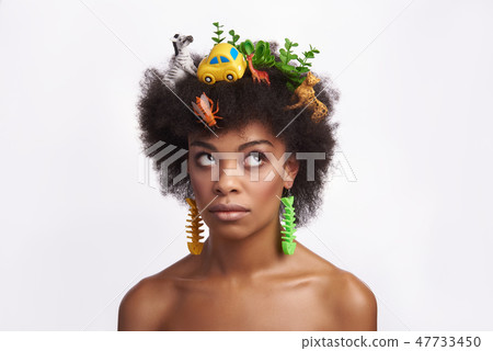 Thoughtful ethnic model rolling her eyes up Thoughtful ethnic model rolling her eyes up 47733450