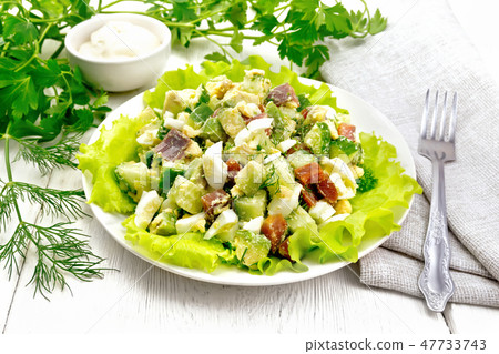 Salad of salmon and avocado on wooden board Salad of salmon and avocado on wooden board 47733743
