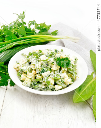 Salad with potatoes and sorrel on table Salad with potatoes and sorrel on table 47733744