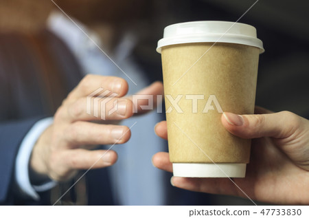 Barista serves coffee to a man. Coffee break 47733830