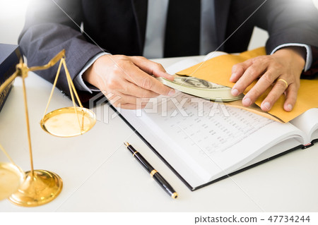 Lawyer being offered receiving money as bribe from client at des Lawyer being offered receiving money as bribe from client at des 47734244