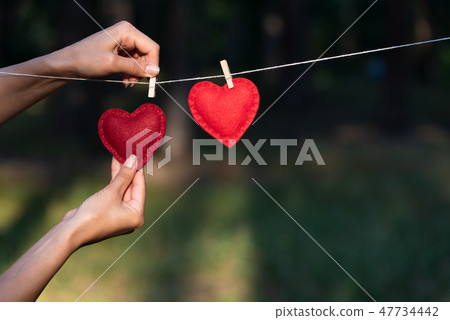 Valentines Day concept with two red hearts 47734442