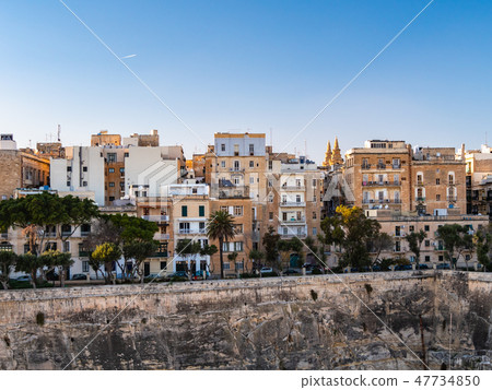 A breathtaking view of Valletta, with its fort overlooking Malta's Grand Harbour and the setting sun. A breathtaking view of Valletta, with its fort overlooking Malta's Grand Harbour and the setting sun. 47734850