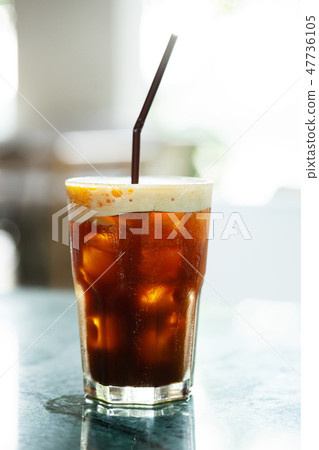 Iced coffee drink with orange slice 47736105