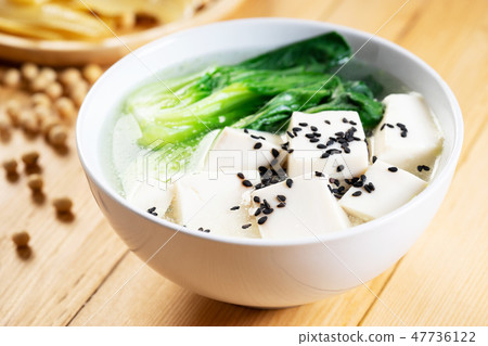 Tofu soup on wooden background 47736122