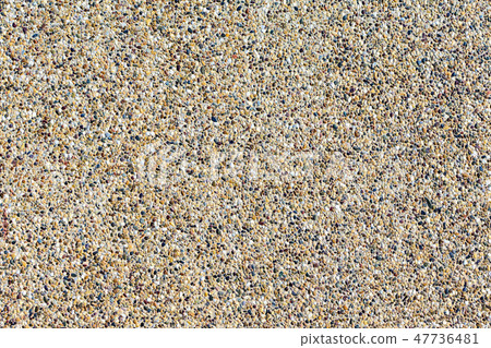 Small pebbles mixed with sand texted background. 47736481