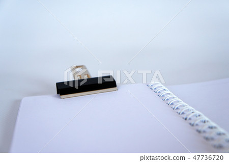 Black color bulldog clip clipping small book 47736720