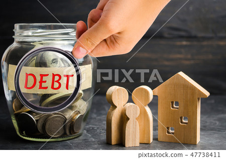 Glass jar with coins and the inscription " Debt " 47738411