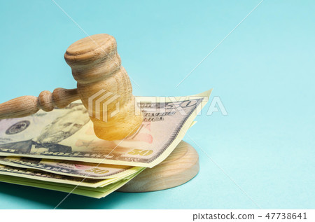 US dollars and judge's hammer / gavel. US dollars and judge's hammer / gavel. 47738641