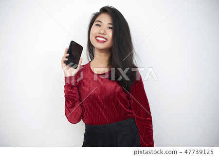 Woman with mobile phone Woman with mobile phone 47739125
