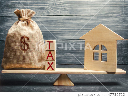 Wooden house and a money bag  47739722