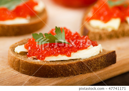 Sandwiches with red caviar 47741171