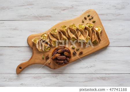 Traditional Arabic crepes stuffed with cream 47741188