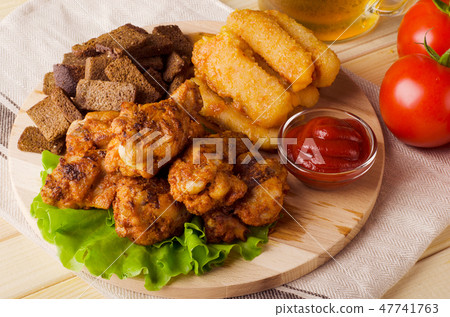 Beer snack, chicken wings, roasted cheese 47741763