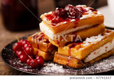 Viennese waffles with powder and berries 47741837