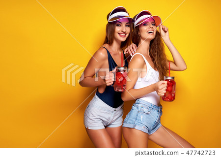 Stylish ladies with drinks 47742723