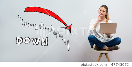 Market down trend chart with young woman using her laptop Market down trend chart with young woman using her laptop 47743072