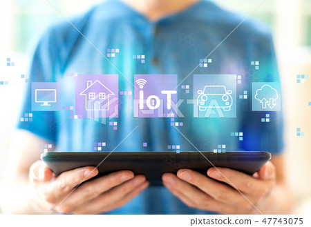 IoT theme with man using a tablet IoT theme with man using a tablet 47743075